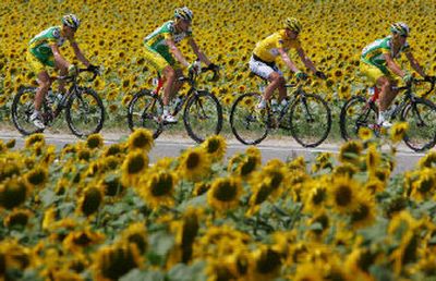 
Overall leader Floyd Landis of the USA, second right, rides with his teammates during the 12th stage Friday. 
 (Associated Press / The Spokesman-Review)