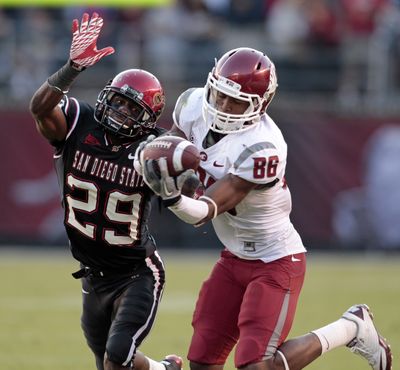 Washington State’s Marquess Wilson catches a 12-yard pass against San Diego State’s Larry Parker. (Associated Press)