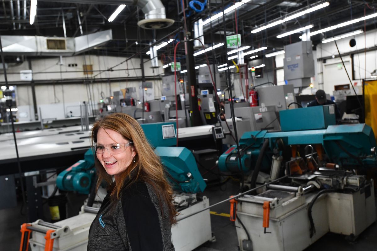 Katie MacKay, vice president and owner of MacKay Manufacturing, smiles Thursday during an Association of Washington Business group tour of the company’s facility in Spokane Valley.  (Tyler Tjomsland/The Spokesman-Review)