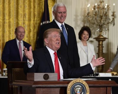 President Donald Trump gestures as he signs a “Space Policy Directive” during a meeting of the National Space Council in the East Room of the White House, Monday, June 18, 2018, in Washington, as Vice President Mike Pence watches. (Susan Walsh / Associated Press)