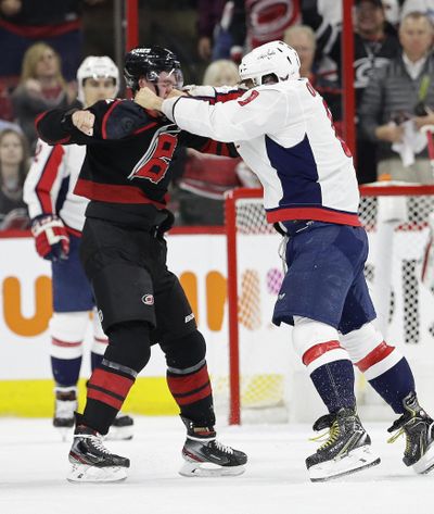 Washington Capitals’ Alex Ovechkin, right, of Russia, punches Carolina Hurricanes’ Andrei Svechnikov, also of Russia, during the first period of Game 3 of an NHL hockey first-round playoff series in Raleigh, N.C., Monday, April 15, 2019. (Gerry Broome / Associated Press)