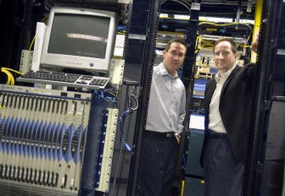 
Shane Desgrosellier, left, meets with One Eighty Networks CEO and Chairman Gregory Green earlier this month.  
 (Christopher Anderson / The Spokesman-Review)
