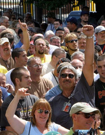
Workers at the Portsmouth Naval Shipyard in Kittery, Maine, cheer at a noontime rally Wednesday after learning their base had been taken off the closure list. 
 (Associated Press / The Spokesman-Review)