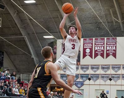 Whitworth guard Sullivan Menard, who is averaging 14.6 points per game, shoots over Pacific Lutheran’s Jackson Reisner during a Northwest Conference game Jan. 20 at the Whitworth Fieldhouse.  (Caleb Flegel/Whitworth University)