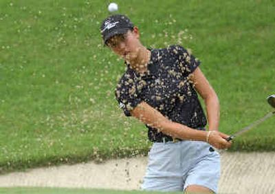 Michelle Wie hits from the bunker on the 12th hole en route to defeating Angela Park in the semifinals.
(Associated Press / The Spokesman-Review)