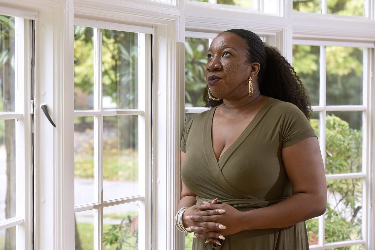 FILE - In this Tuesday, Oct. 13, 2020 file photo, Tarana Burke, founder and leader of the #MeToo movement, stands for a portrait in her home in Baltimore. For Burke, her first reaction to the Wednesday, June 30, 2021, Pennsylvania court decision on Bill Cosby's release was ”shock, definitely shock.” “And as the shock settled in and I started seeing some of the (social media) commentary coming in … we, folks who do this work across the field, started huddling together to talk about what our response would be,” Burke said in an interview. “It was just real concern for survivors. We’re going to have a hard time sleeping.”  (Steve Ruark)