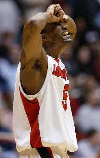 
Louisville guard Taquan Dean reacts as it becomes obvious that the Cardinals will triumph. 
 (Associated Press / The Spokesman-Review)