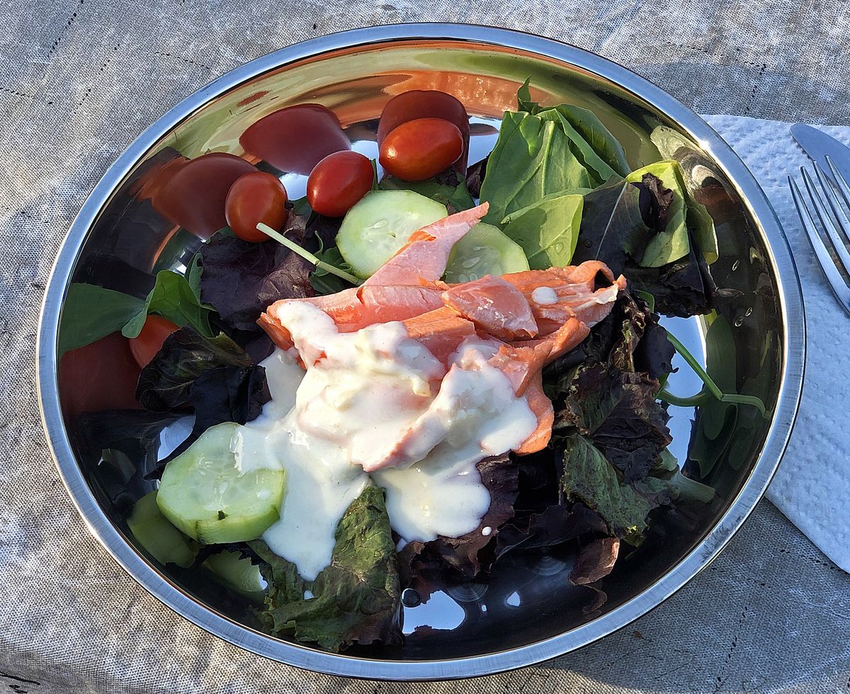 Chinook salmon poached in cider is served over a salad. (Leslie Kelly)