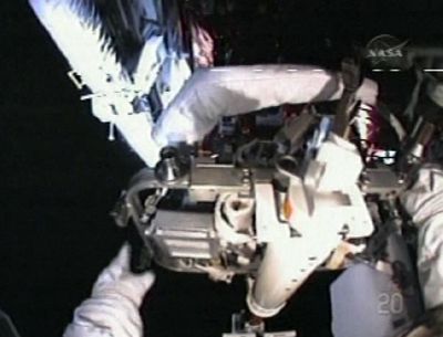 In this image from NASA TV, astronauts work to upgrade the Hubble Space Telescope during a spacewalk Sunday.  (Associated Press / The Spokesman-Review)