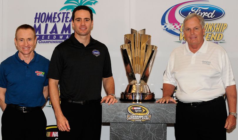 Mark Martin (left), driver of the No. 5 Kellogg's Chevorlet, Jimmie Johnson (center), driver of the No. 48 Lowe's/KOBALT Tools Chevorlet, and team owner Rick Hendrick pose with the NASCAR Sprint Cup trophy during the NASCAR Championship Contenders Press Conference on Thursday at the Hyatt Regency in Coral Gables, Fla. The three were later joined for media availabilities by three-time Daytona 500 winner Bobby Allison and Miami resident and NASCAR Sprint Cup Series driver of the No. 42 Target Chevrolet, Juan Pablo Montoya. (Photo Credit: Sam Greenwood/Getty Images for NASCAR)  (Sam Greenwood / Getty Images North America)