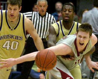 
WSU's Aron Baynes, right, fights off UW's Jon Brockman. The two wins over UW may help earn a spot in the NIT.
 (JOE BARRENTINE Associated Press / The Spokesman-Review)