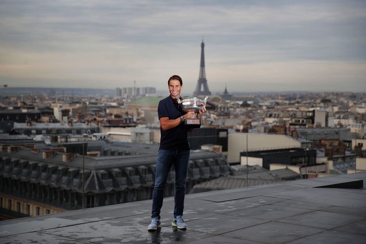Spain's Rafael Nadal poses with his trophy during a photo call on the rooftop of Galeries Lafayette, Monday, Oct. 12, 2020, after winning Sunday the final match of the French Open tennis tournament against Serbia's Novak Djokovic in three sets, 6-0, 6-2, 7-5 at the Roland Garros stadium.  (Francois Mori)