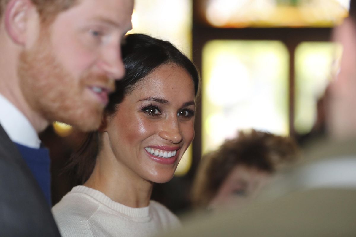 Prince Harry and Meghan Markle, during a visit to the Crown Bar in Belfast Northern Ireland, where they learnt from National Trust representatives about the pub’s heritage, and met bar staff, local comedians and musicians Friday March 23, 2018. Prince Harry and Meghan will be married at St. George’s Chapel in Windsor Castle on May 19. (Gareth Fuller / Associated Press)