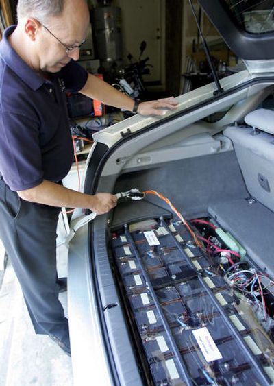 
Ron Gremban shows the batteries he added to his Toyota Prius at his home in Corte Madera, Calif. 
 (Associated Press / The Spokesman-Review)