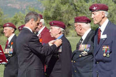 
French Minister for the aging Hubert Falco awards the Legion of Honor to British veteran Rees Master during a ceremony Saturday in La Motte, southern France. 
 (Associated Press / The Spokesman-Review)