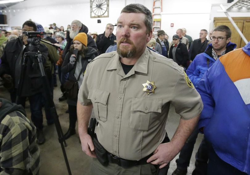 In this Jan. 6, 2016 file photo, Harney County Sheriff David Ward arrives at a community meeting at the Harney County fairgrounds in Burns, Oregon. Ward, whose jurisdiction includes the Malheur National Wildlife Refuge, cooperated with federal and state police during the siege at the Malheur National Wildlife Refuge. In the next county to the north his counterpart, a member of the Constitutional Sheriffs and Peace Officers Association, questioned the FBI’s authority. (Rick Bowmer / AP)