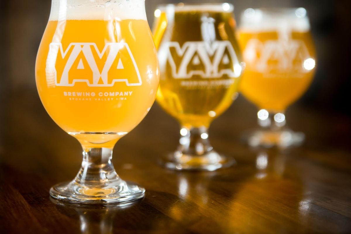 From left: the Fluffy Puffy Sunshine New England IPA, the 1603 Kolsch Style Ale, and the Angel West Coast IPA are pictured in the YaYa Brewing Company taproom in Spokane Valley, Wash. on Dec. 16, 2020. YaYa Brewing Co., owned by brothers Chris and Jason Gass, recently celebrated its first anniversary in business and is open for to-go orders at 11712 E. Montgomery Drive.  (Libby Kamrowski/ THE SPOKESMAN-REVIEW)