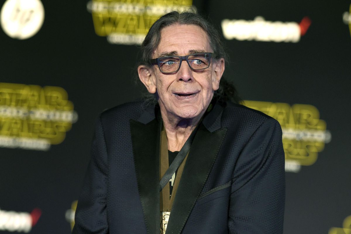 Peter Mayhew arrives at the world premiere of “Star Wars: The Force Awakens,” Dec. 14, 2015, in Los Angeles. Mayhew, who played the rugged, beloved and furry Wookiee Chewbacca in the “Star Wars” films, has died. Mayhew’s family said in a statement that he died at his home in Texas on Friday, April, 26, 2019. He was 74. No cause was given. (Jordan Strauss / Associated Press)