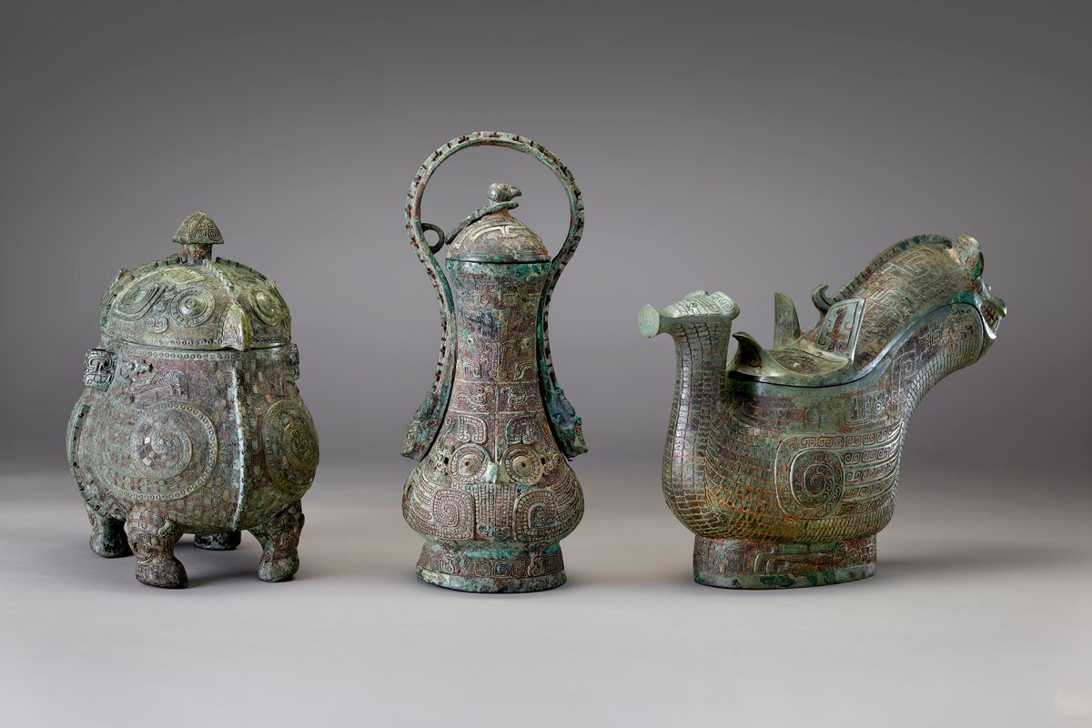 The artifacts on display in "Anyang: China's Ancient City of Kings" include, left and middle, two bronze ritual wine containers, and right, a bronze ritual wine pouring vessel. MUST CREDIT: National Museum of Asian Art, Smithsonian Institution.  (National Museum of Asian Art/Handout)