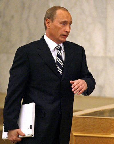 
Russian President Vladimir Putin walks to  address lawmakers in  Moscow's Kremlin on Thursday. 
 (Associated Press / The Spokesman-Review)