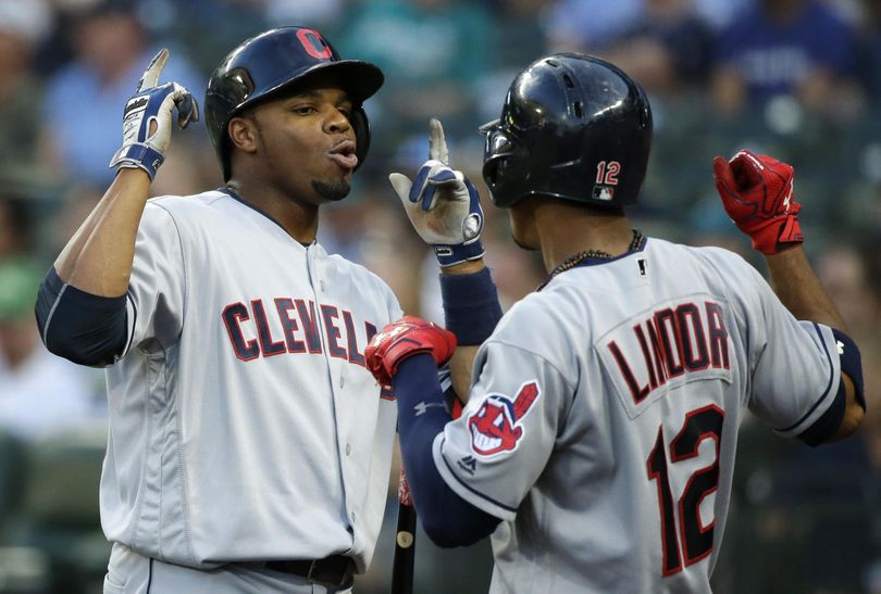 Cleveland’s Rajai Davis, left, celebrates his fifth-inning solo home run with teammate Francisco Lindor. (Ted S. Warren / Associated Press)