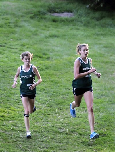 Chelsea Chandler, right, running with Shadle Park teammate Kendra Weitz, played on the state-champion volleyball team last season but switched to cross country this season.jesset@spokesman.com (Jesse Tinsley / The Spokesman-Review)