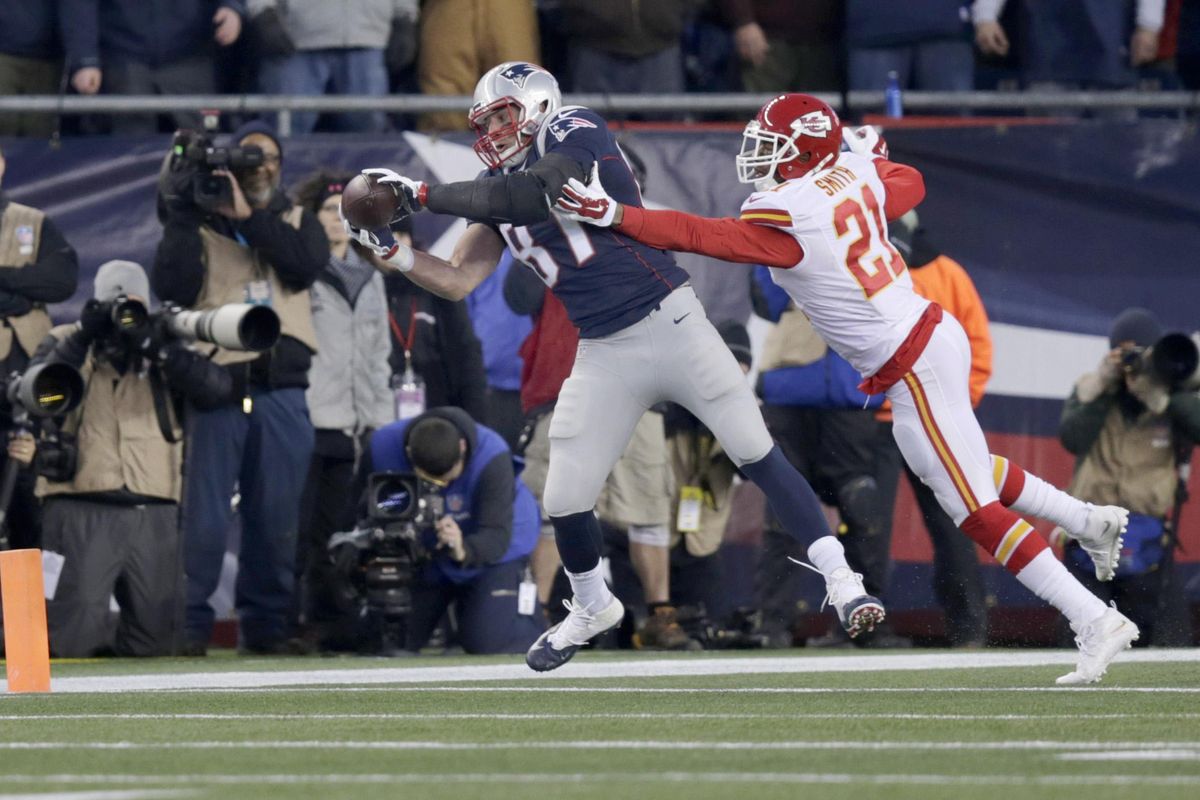 New England Patriots tight end Rob Gronkowski, left, has been known to push off defenders according to the Denver Broncos defense.