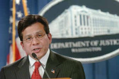 
Attorney General Alberto Gonzales talks about the arrests of more than 10,000 fugitives nationwide during a news conference at the Department of Justice on Thursday in Washington. 
 (Associated Press / The Spokesman-Review)