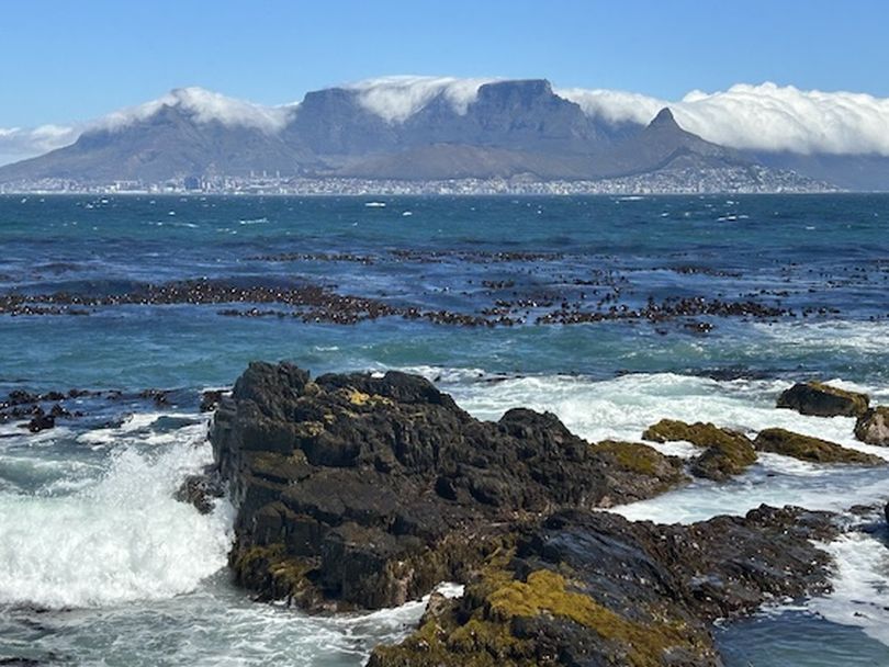 Seen from Robben Island, cloud-shrouded Table Mountain looms over Cape Town. (Dan Webster)