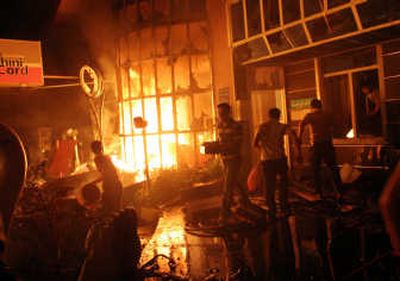 
Iranians burn a gas station in Tehran on Wednesday during a protest against gas rationing. Associated Press
 (Associated Press / The Spokesman-Review)