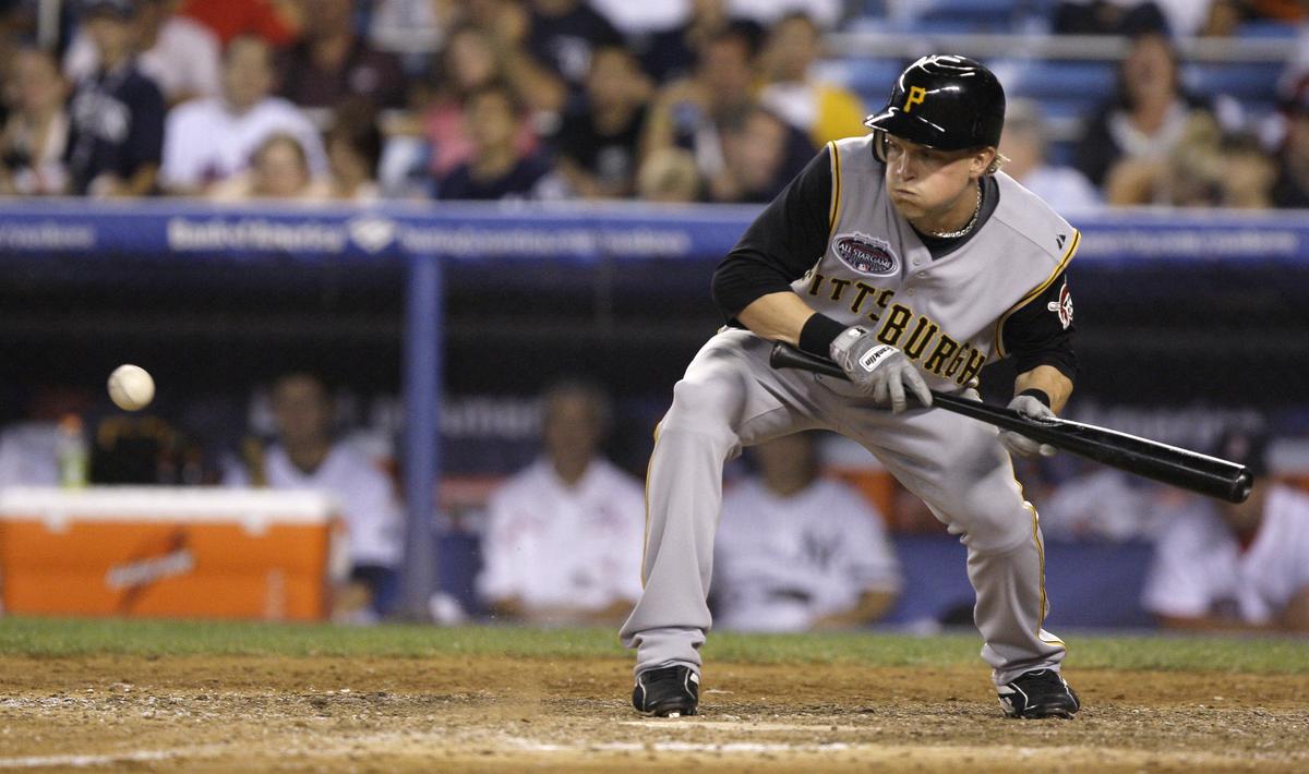 Pittsburgh’s Nate McLouth bunts for a single during the 12th.  (Associated Press / The Spokesman-Review)