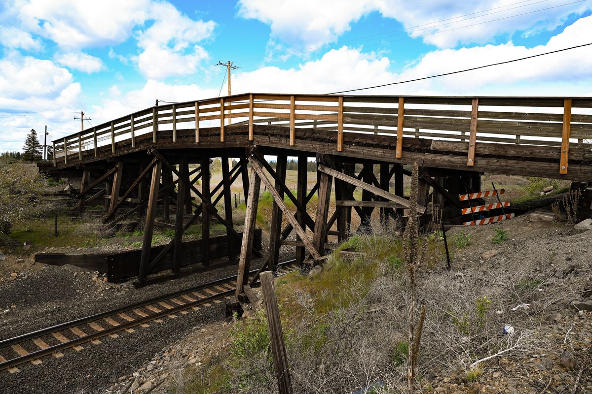 The Euclid Road Bridge lies in a state of disrepair in this May 2022 photo. The bridge is slated to be replaced by September, ending a four-year closure caused by structural failure of the span that was rebuilt in 1980 after a fire.  (COLIN MULVANY/THE SPOKESMAN-REVIEW)