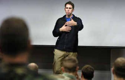 
Ron Young speaks to an audience of Survival School students at Fairchild Air Force Base Friday. Young spent 22 days as a POW after being shot down last year while piloting an Army helicopter. 
 (Christopher Anderson/ / The Spokesman-Review)
