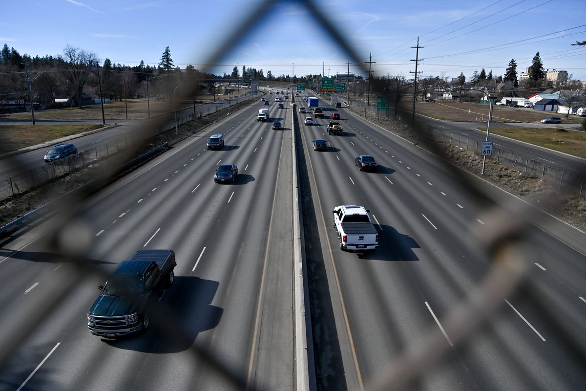 Empty lots flanking Interstate 90 are photographed as traffic passes through the East Central neighborhood on Friday in Spokane.  (Tyler Tjomsland/The Spokesman-Review)