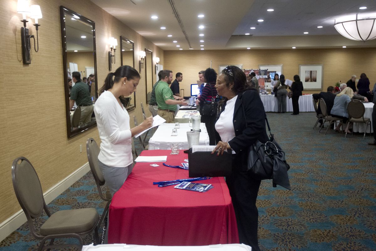 In this Friday, Nov. 30, 2012 photo, a person fills out an application at the Fort Lauderdale Career Fair, in Dania Beach, Fla. The U.S. economy added a solid 146,000 jobs in November and the unemployment rate fell to 7.7 percent, the lowest since December 2008, the Labor Department announced Friday, Dec. 7, 2012. The government said Superstorm Sandy had only a minimal effect on the figures. (J Carter / Associated Press)