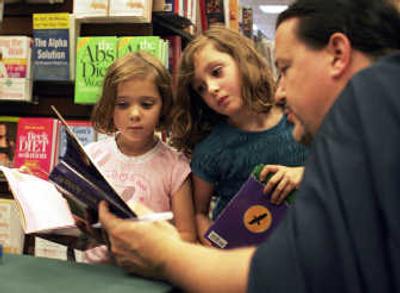 
Wayne Batson, right, declares Kendall and Katherine Fronabarger 