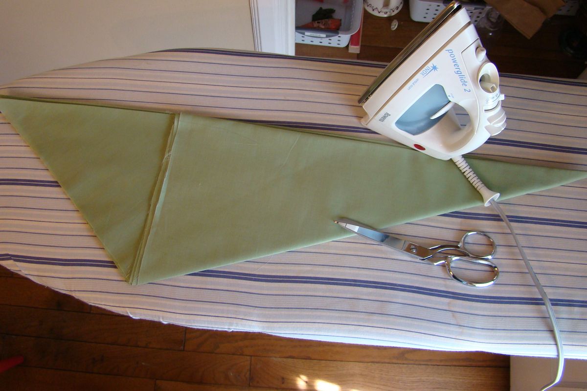 Fold the fabric diagonally eight times after ironing it perfectly flat. Make sure your creases are good and sharp. (Maggie Bullock)