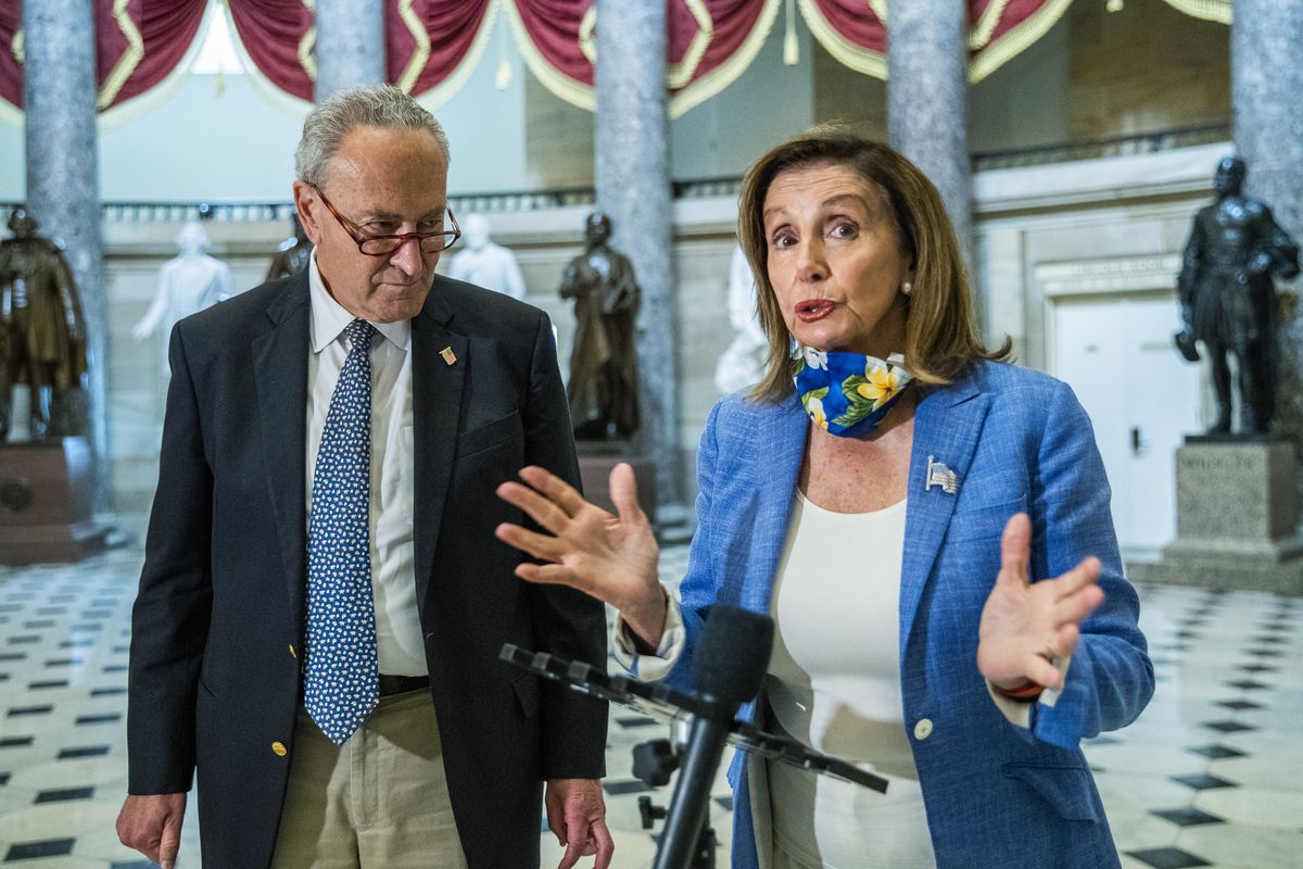 House Speaker Nancy Pelosi of Calif., with Senate Minority Leader Chuck Schumer of N.Y., speaks to reporters following a meeting at the Capitol with White House chief of staff Mark Meadows and Treasury Secretary Steven Mnuchin on a COVID-19 relief bill, Saturday, Aug. 1, 2020, in Washington. (Manuel Balce Ceneta)