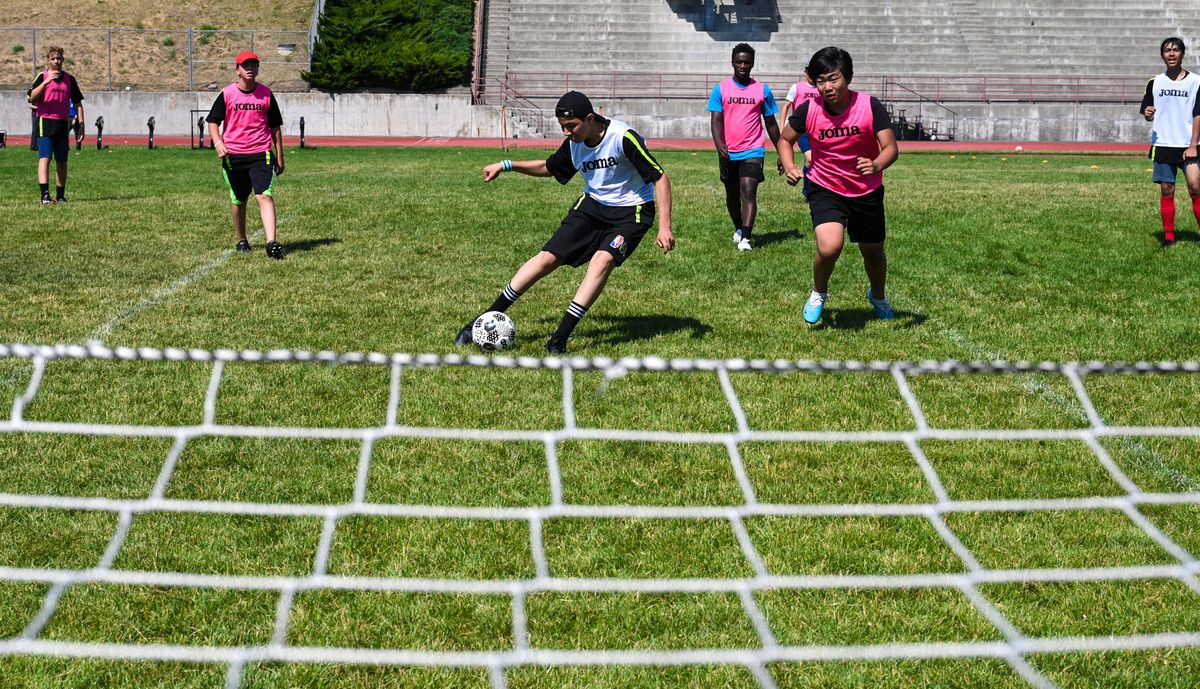 Thrive Nation Soccer Camp participant Ayman Sultan, of Syria, fires a shot on goal during play, Thursday, June 28, 2023, in Spokane.  (DAN PELLE/THE SPOKESMAN-REVIEW)