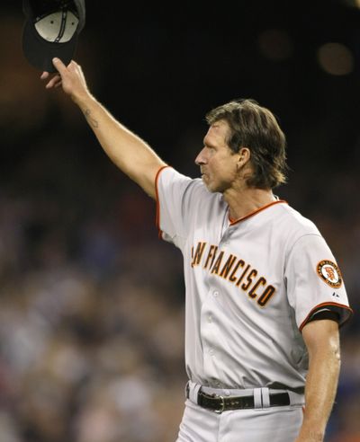 Randy Johnson tips his hat to the Safeco Field crowd as he leaves Friday’s game.  (Associated Press / The Spokesman-Review)