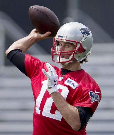 Patriots’ QB Tom Brady is ending his legal battle with the NFLPA. (Michael Dwyer / Associated Press)