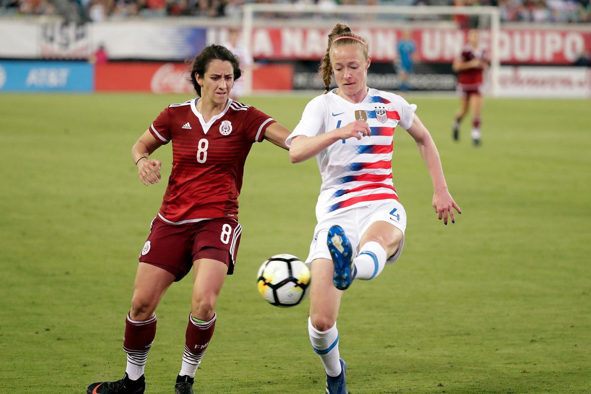 In this April 5, 2018 file photo, United States’ Becky Sauerbrunn (4) clears the ball away from Mexico’s Ariana Calderon (8) during the second half of an international friendly soccer match in Jacksonville, Fla. If the defending champions make the field for soccer’s premier event in France next year, it will be Sauerbrunn’s third World Cup. (John Raoux / Associated Press)