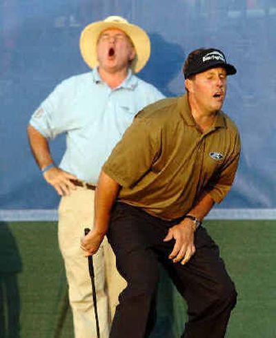 
Phil Mickelson misses a chip on the 18th that would have tied the score with Tiger Woods. 
 (Associated Press / The Spokesman-Review)