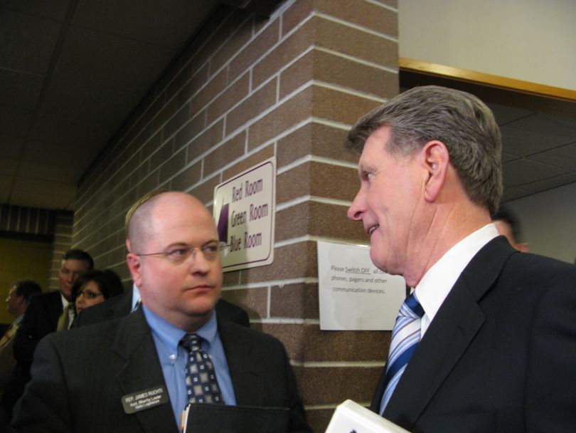 Rep. James Ruchti, D-Pocatello, and Gov. Butch Otter engage in an impromptu debate about state funding priorities after Otter's State of the State speech, 1/12/09. (Betsy Russell / The Spokesman-Review)