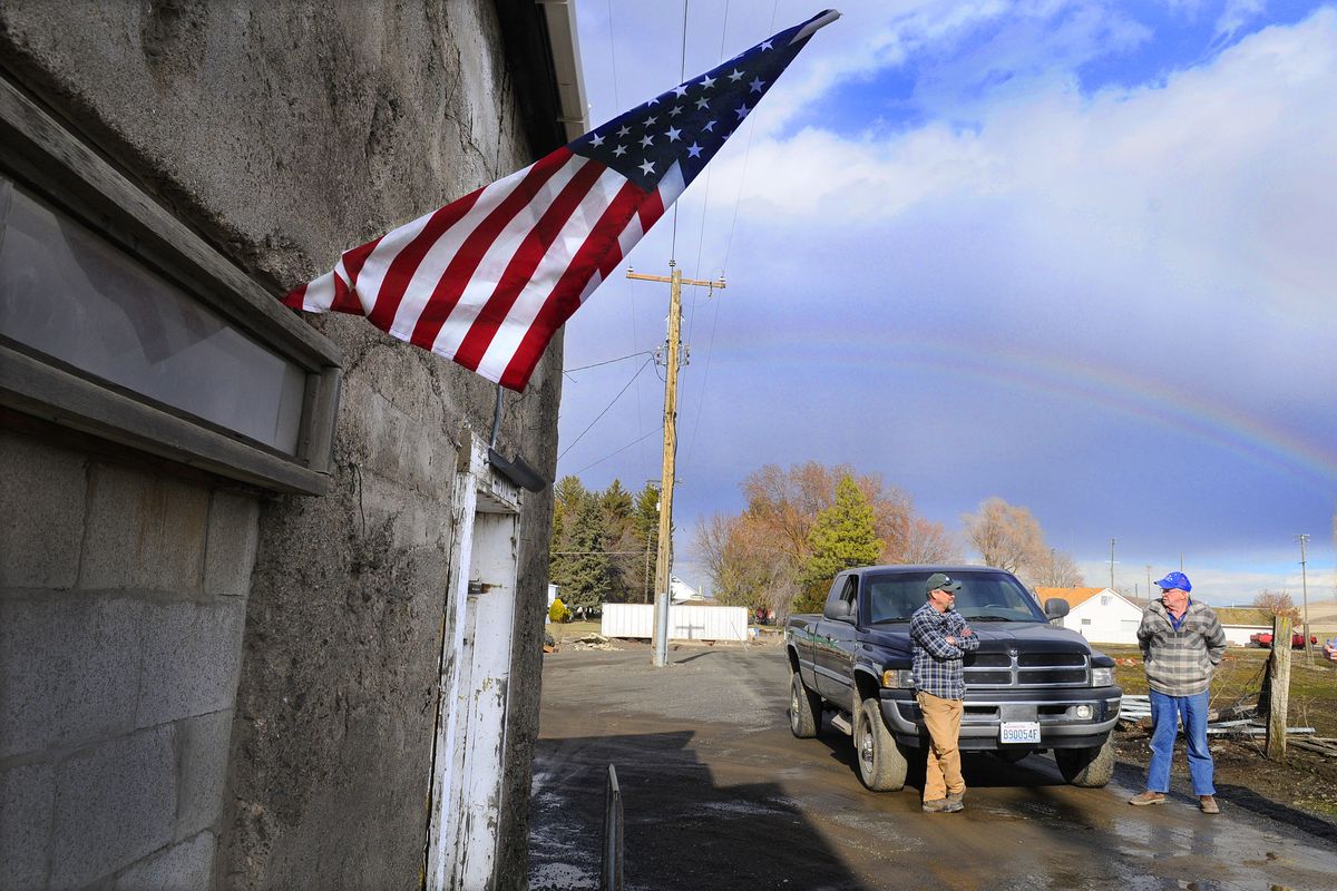 Don Keeney, left, and Mayor Larry “Butch” Burgess discuss city issues outside the LaCrosse city shop Wednesday.