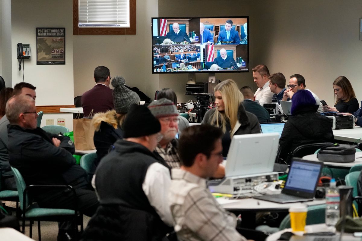Members of the media monitor the trial of Kyle Rittenhouse in an overflow room at the Kenosha County Courthouse in Kenosha, Wisc., Monday, Nov. 15, 2021. Rittenhouse is accused of killing two people and wounding a third during a protest over police brutality in Kenosha, last year.  (Charles Rex Arbogast)
