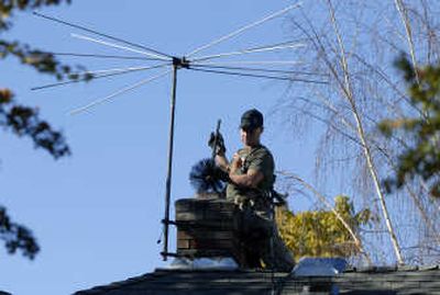 
Johnny Howell, of Spokane Chimney and Masonry, slides a brush down a furnace chimney of a house on the 5300 block of North Washington Street on Thursday. With cold weather approaching, homeowners are keeping him busy cleaning as many as six chimneys a day. 
 (Dan Pelle / The Spokesman-Review)