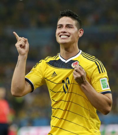 Colombia midfielder James Rodriguez celebrates the second of his two goals against Uruguay on Saturday. (Associated Press)