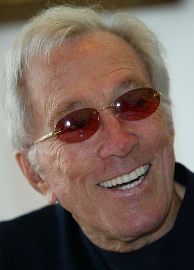 In this July 25, 2004 file photo, U.S. singer Andy Williams smiles as he speaks to reporters during his news conference at a Tokyo hotel. Emmy-winning TV host and 