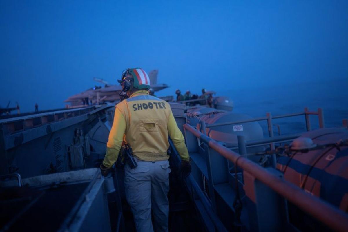 Aboard the USS George Washington, young sailors adjust to war with